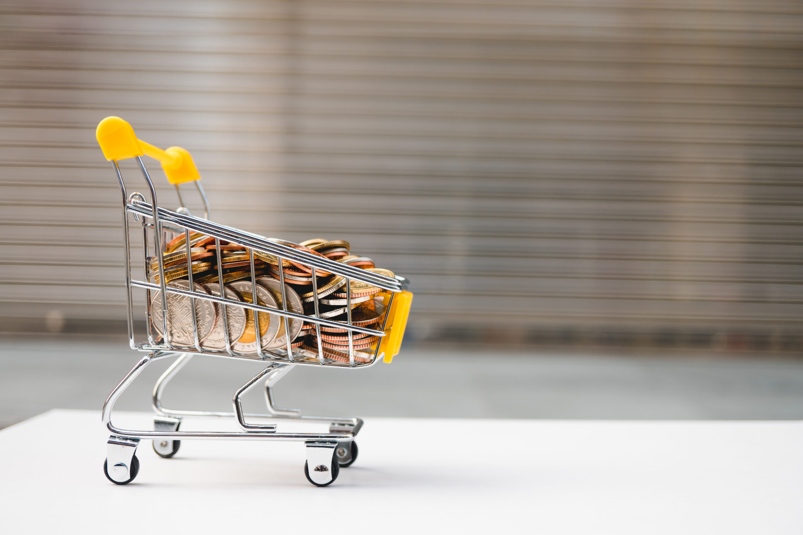 Mini shopping cart contain stack coins