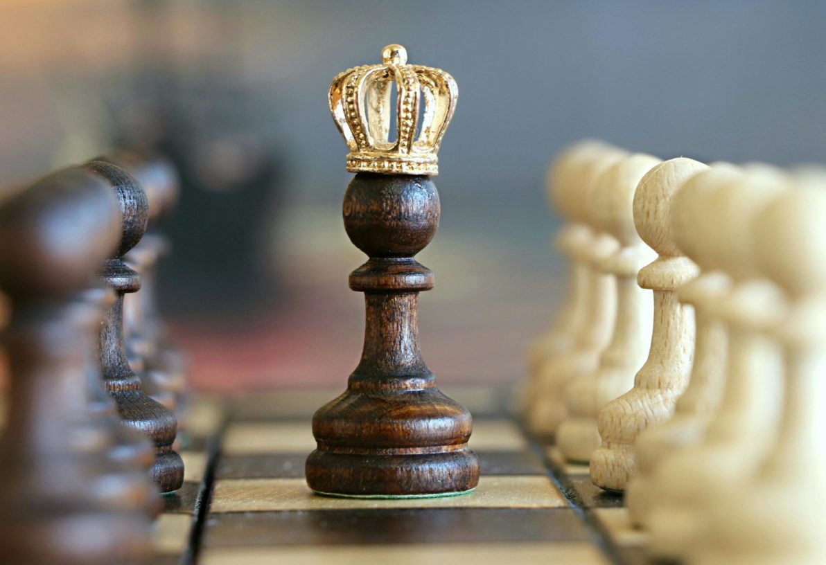 Chess king with gold crown representing strategy and success in trading